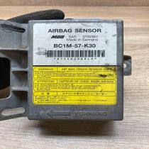 BC1M 57 K30 12192601  Airbag control unit/module Mazda 323