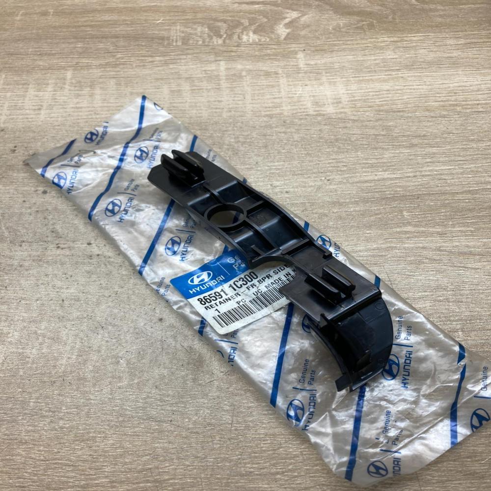 86591 1C300  Left side Front bumper mounting bracket Hyundai Getz